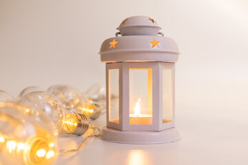 Christmas tree in a pot on white background. Christmas tree decoration. Lantern with candle and...