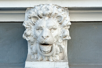 Architectural decoration depicting lion head with ring in jaws of old building in Odesa Ukraine