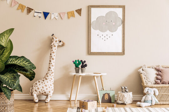 Stylish scandinavian kid room with mock up poster, toys, teddy bear, plush animal, natural pouf and children accessories. Modern interior with beige background walls. Template. Design home staging.