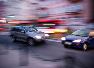 Car accident. Two cars crashed on the city road. Intentional motion blur