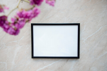 Greeting, post card, photo frame mock up on marble background with the pink flowers decor.