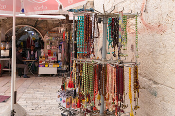 Arabic rosary stand for sale in a street shop near Lions Gate in the old city of Jerusalem in Israel