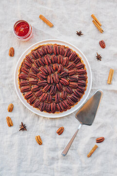 Delicious Freshly Baked Homemade Pecan Pie On White Tablecloth. Sweet Food From Above. Popular Holiday Meal For Thanksgiving And Christmas.