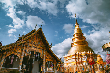 Naklejka premium Wat Phrathat Haripunchai Woramahawihan during Loy Khratong lantern festival in Lamphun, Chiang Mai, Thailand