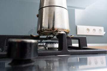 Italian metallic coffee maker. Mocha coffee pot for making espresso coffee. Coffee maker on gas stove