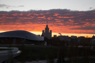 Naklejka premium Zaryadye Park, Kotelnicheskaya Embankment Building skyscraper and Moscow city center panorama. City sunrise landscape with sunlight and beautiful sky on the Moscow River, Russia 