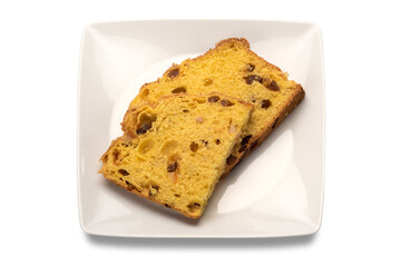 two slices of panettone on the white rectangular plate in top view, typical Italian dessert for Christmas from Milan, isolated on white background