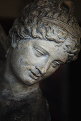 Close up Olympic goddess of love and beauty Aphrodite (Venus). Fragment of ancient statue.