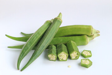 Fresh vegetable okra on white background.