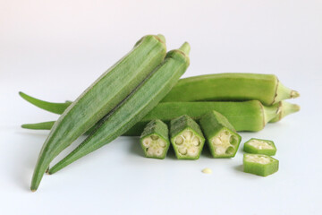 Fresh vegetable okra on white background.