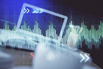 Naklejka premium Forex market chart hologram and personal computer background. Multi exposure. Concept of investment.