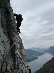 Climber at Drachenwand via ferrata, Salzburg, Austria