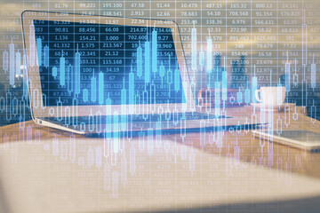 Financial graph colorful drawing and table with computer on background. Multi exposure. Concept of...