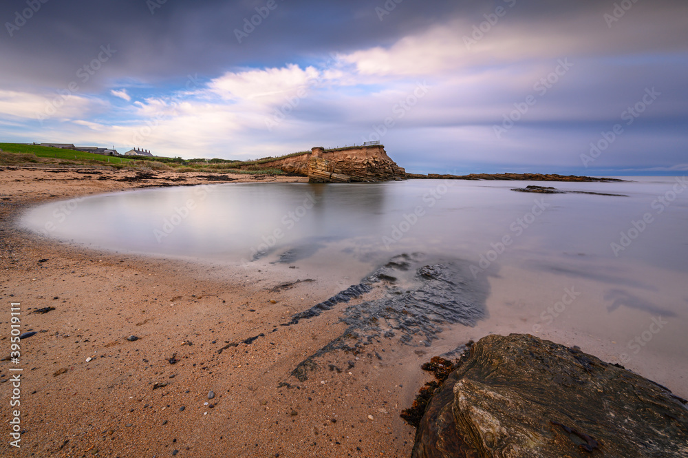 Poster howick haven sandy bay, on the rocky shoreline at howick on the northumberland coast, aonb, where th