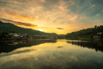 Beautiful of lake view in the morning sunrise, Ban Rak Thai village, landmark and popular for tourists attractions, Mae Hong Son province, Thailand. Travel concept
