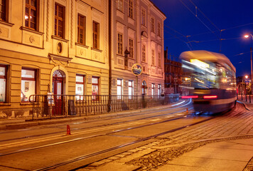 Fototapeta na wymiar old Polish street with a passing tram