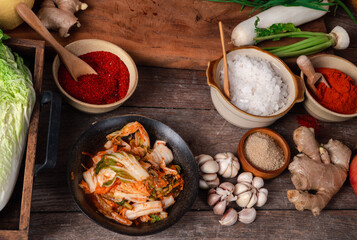 Fresh ingredients and vegetables Placed in the table For making Kimchi Which contains ingredients such as ginger, garlic, salt, onion, sugar, gochugaru (Korean chili). Kimchi is a healthy food.