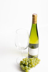 Fototapeta premium Wine bottle and two wine glasses. Wine bottle against a white background