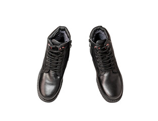 Pair of black genuine leather boots. Men's clothing. Isolated over white background. View from above.