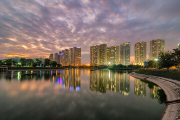 Fototapeta na wymiar Cityscape of Hanoi skyline at Thanh Xuan park during sunset time in Hanoi city, Vietnam