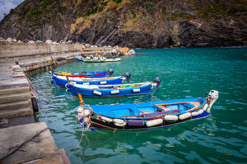 Boats and houses in the small harbour of Vernazza in Cinque Terre,  Italy