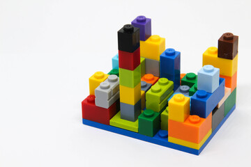 Obraz premium Colorful plastic building blocks isolated on white background.