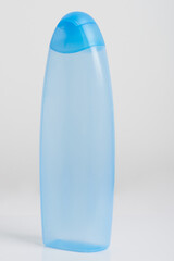 Empty blue plastic bottle