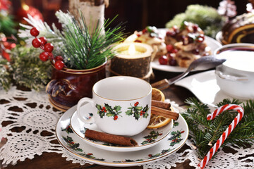 Fototapeta premium Christmas table setting in white red green colors in rustic style