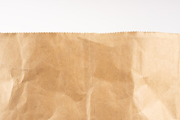 Craft paper. Crumpled brown cardboard paper texture. Old Crumpled recycled paper texture, color beige. Brown background