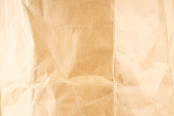 Craft paper. Crumpled brown cardboard paper texture. Old Crumpled recycled paper texture, color beige. Brown background