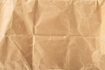 Craft paper. Crumpled brown cardboard paper texture. Old Crumpled recycled paper texture, color beige. Brown background