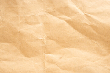 Craft paper. Crumpled brown cardboard paper texture. Old Crumpled recycled paper texture, color beige. Brown background
