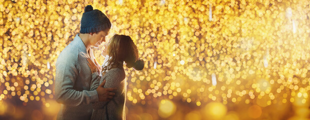 beautiful portrait of a young couple in christmas light