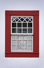 Colonial window and lace curtain in Tiradentes, Brazil   