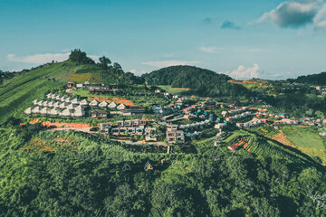 Aerial view of camping grounds and tents on Doi Mon Cham mountain in Mae Rim, Chiang Mai province, Thailand