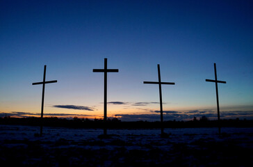 Silhouette the cross on sunset background