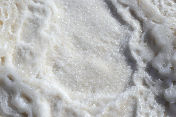 Texture of Dead Sea. Salty sea shore background. Salt accumulation on the Dead Sea shore in Jordan