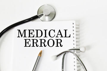 medical text MEDICAL ERROR on the card. white background, stethoscope, medicine. medical concept