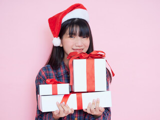 Happy smiling woman holding gift boxes