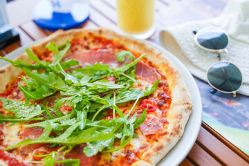parma ham and rocket salad on margarita pizza