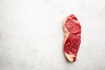 Raw fresh meat New York beef Steak on white background, top view