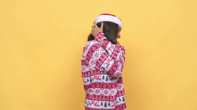 Young latin woman celebrating christmas day hugs, smiling carefree and happy