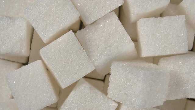 Rotation of sugar lumpy close-up. White sugar. Sugar cubes.