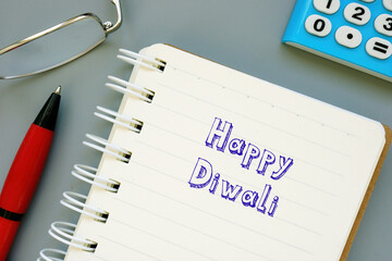 Financial concept meaning Happy Diwali with phrase on the piece of paper.