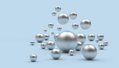 A group of falling silver spheres of various sizes on a light blue background. 3d illustration