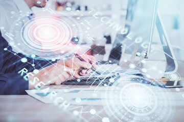 Double exposure of data internet theme hologram with man working on computer on background. Concept of innovation.