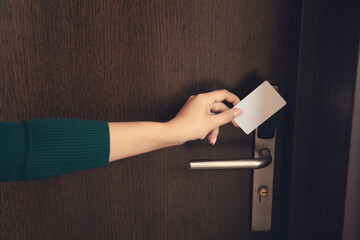 woman holding a key card