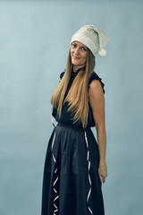 Girl wearing santa claus hat and new year decorations. Meeting of Christmas and New Year.