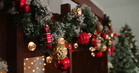 4k footage of big heap of gifts and present next to burning fireplace and glowing Christmas tree in living room on Christmas eve