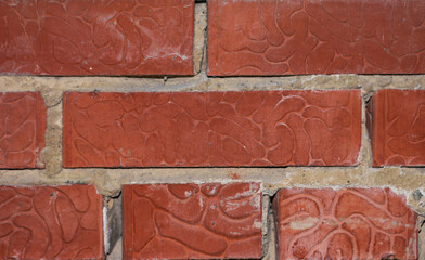 background section of brick wall dark red close-up.